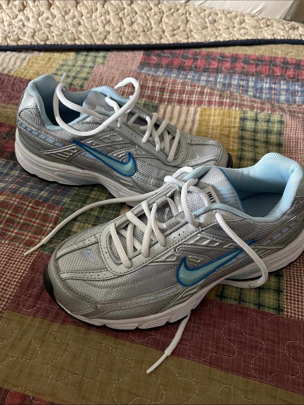 Nike Women’s Silver Sneakers with Blue Accents